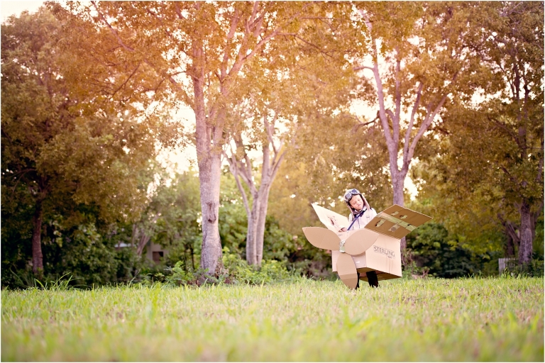 Boy in cardboard airplane Child Creative Photoshoot