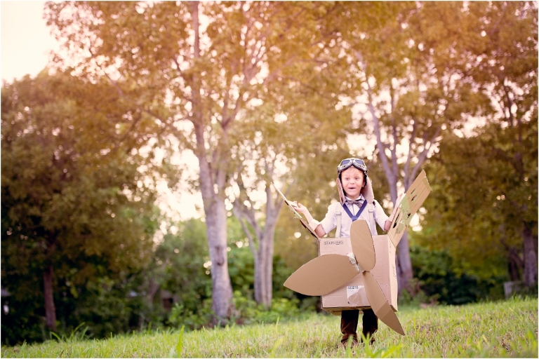 Boy in cardboard airplane Child Creative Photoshoot