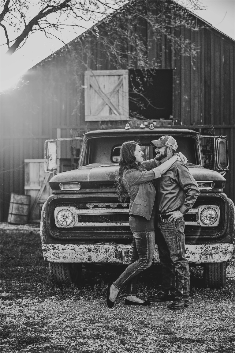 Couple Photographer in Round Rock Texas by Vintage Truck in front of Barn