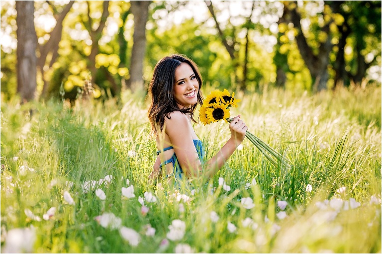 Senior Portrait Girl in field with Sunflowers and in blue dress Georgetown Texas Photographer