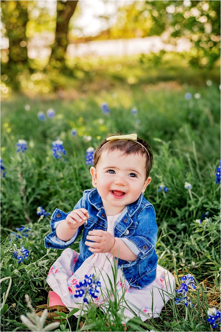 Beautiful Little Girl with Boy and Jean Jacket sitting in Spring Bluebonnets in Round Rock Texas by Natural Light Child Photographer