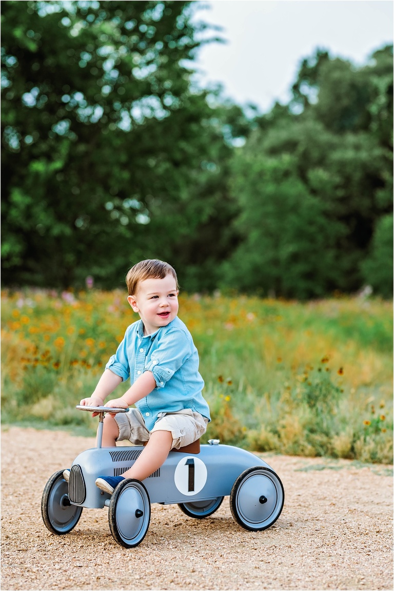 Little boy's second birthday toddler on bike in park Austin, Texas child photographer