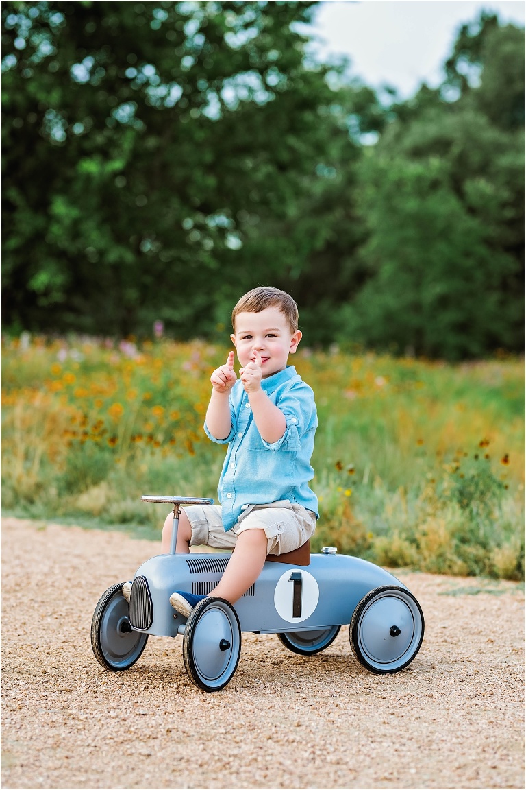 Little boy's second birthday toddler on bike in park Austin, Texas child photographer