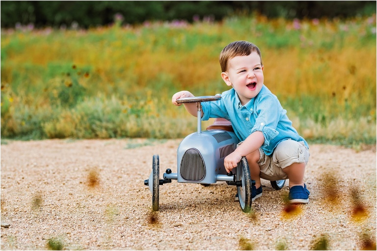 Little boy's second birthday toddler on bike in park Austin, Texas child photographer