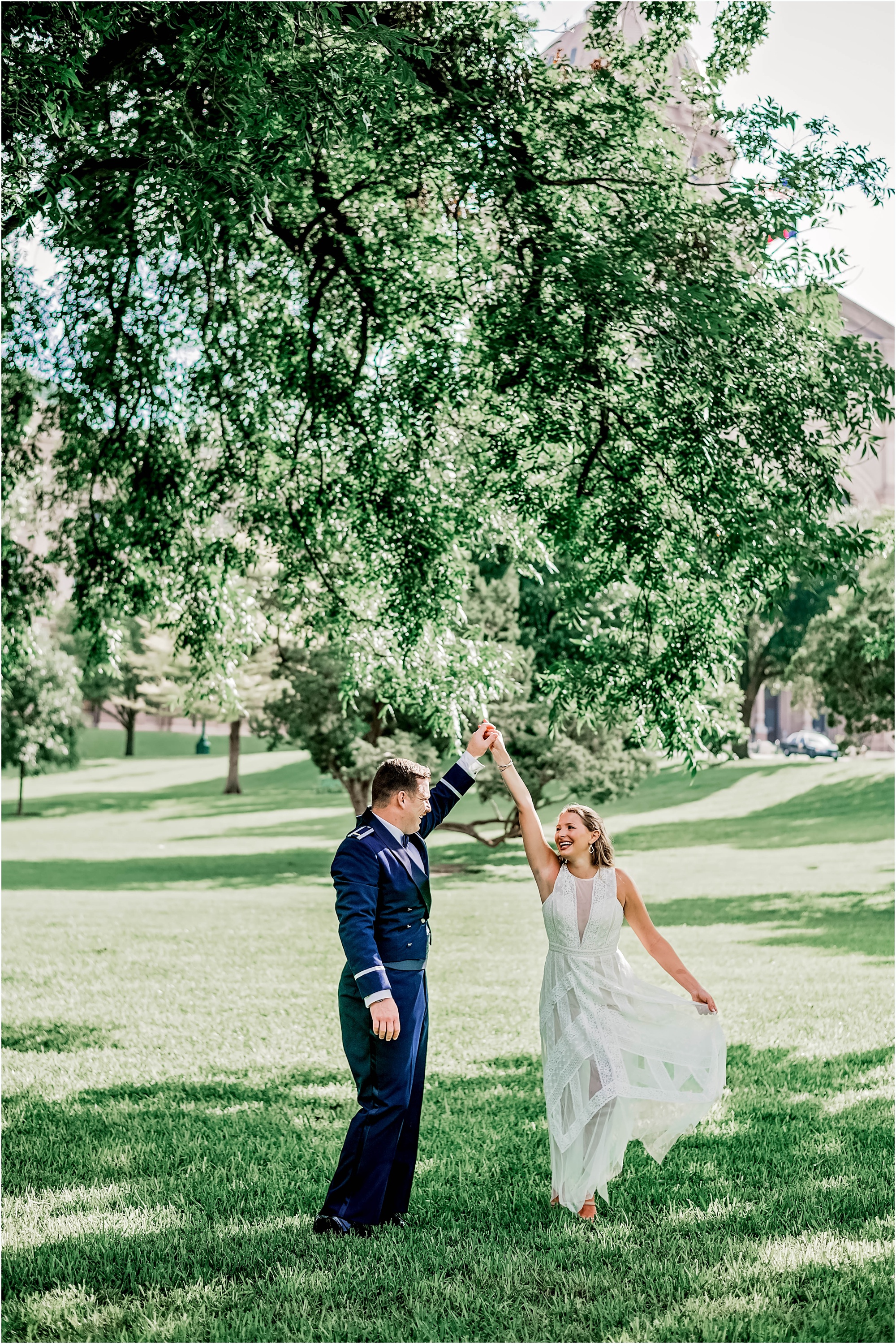 Newly Weds dancing in field outside of State Capital Building in Austin Texas