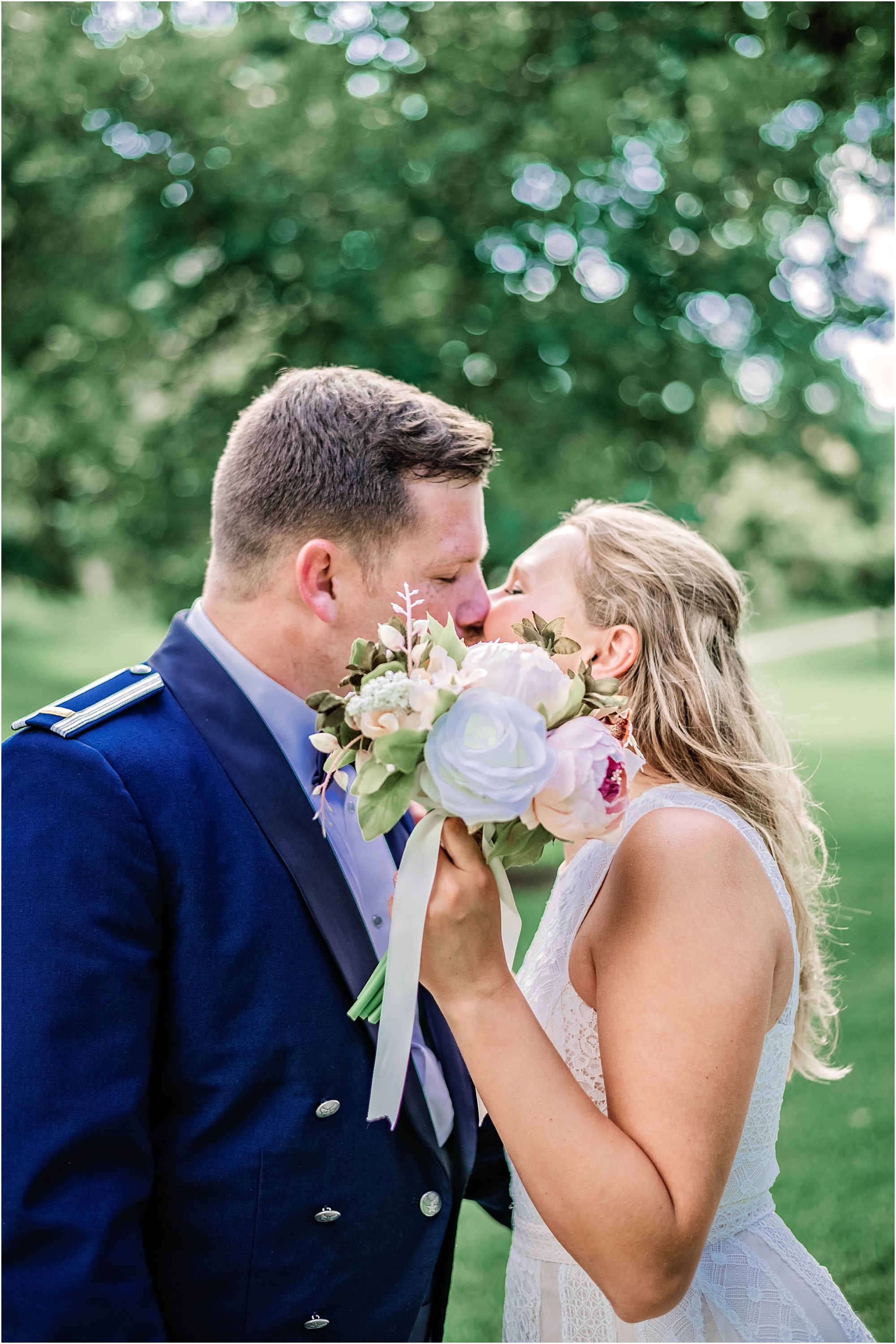 Newly Wed Couple Kissing Behind Flowers in South Austin Texas