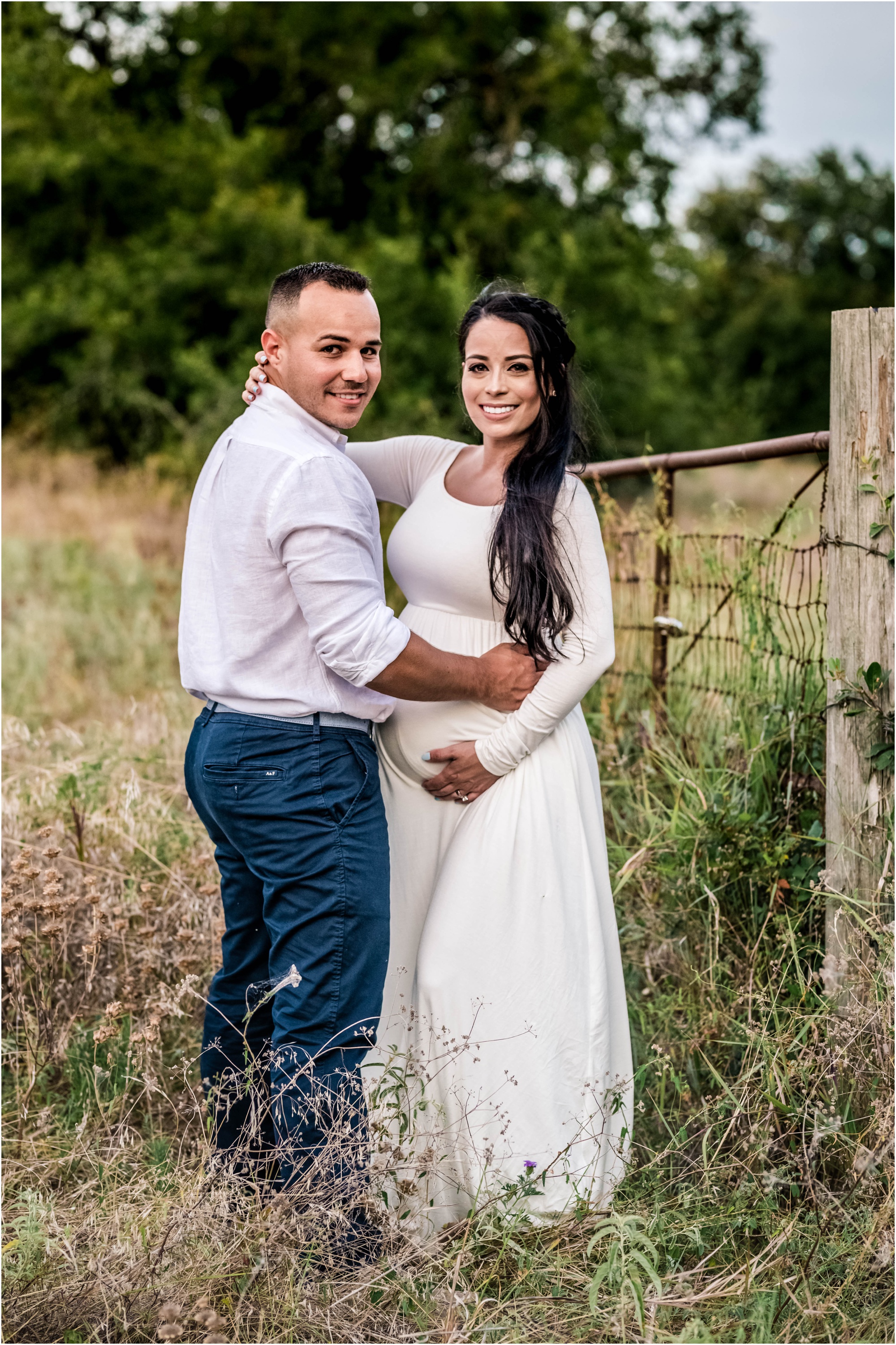 Couple in field during maternity photoshoot in Cedar Park Texas by natural light family photographer