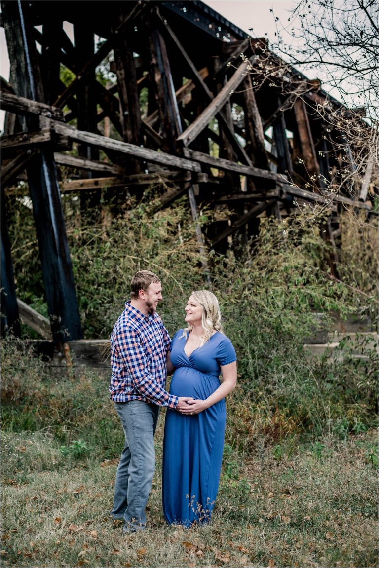 Maternity session with couple near bridge in Cedar Park Texas by natural light milestone photographer