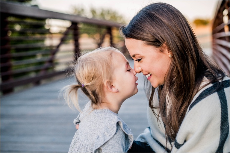 mother and daughter snuggling nose to nose during family photoshoot in round rock texas natural light portrait photographer