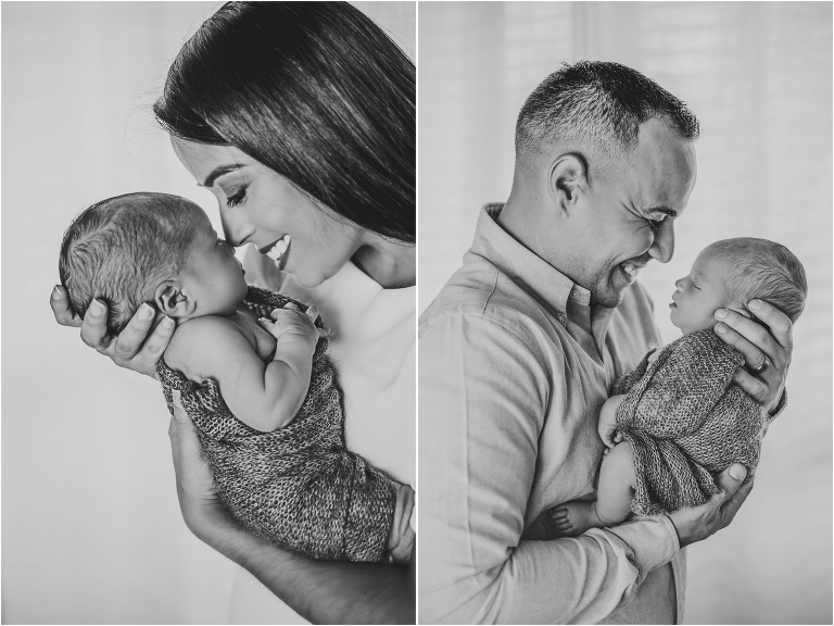 Mother and father snuggling newborn during indoor family photoshoot by natural light portrait photographer Austin Texas