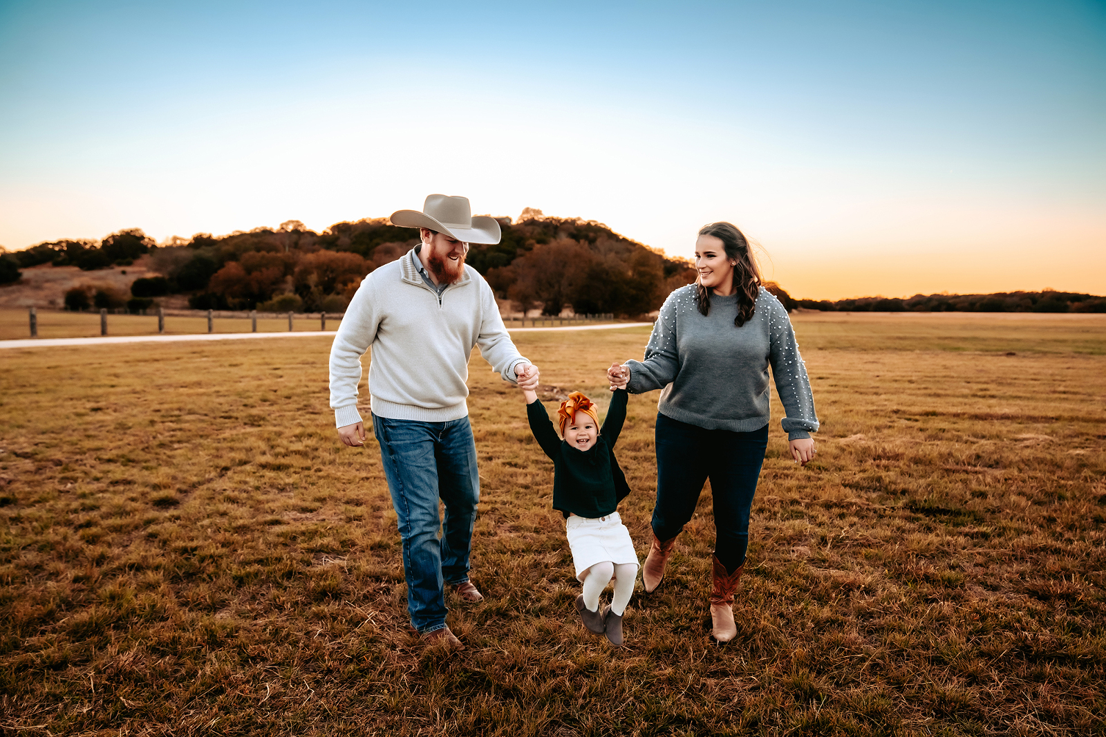 Family Session in Georgetown Session with Natural Light photographer playing with daughter in field