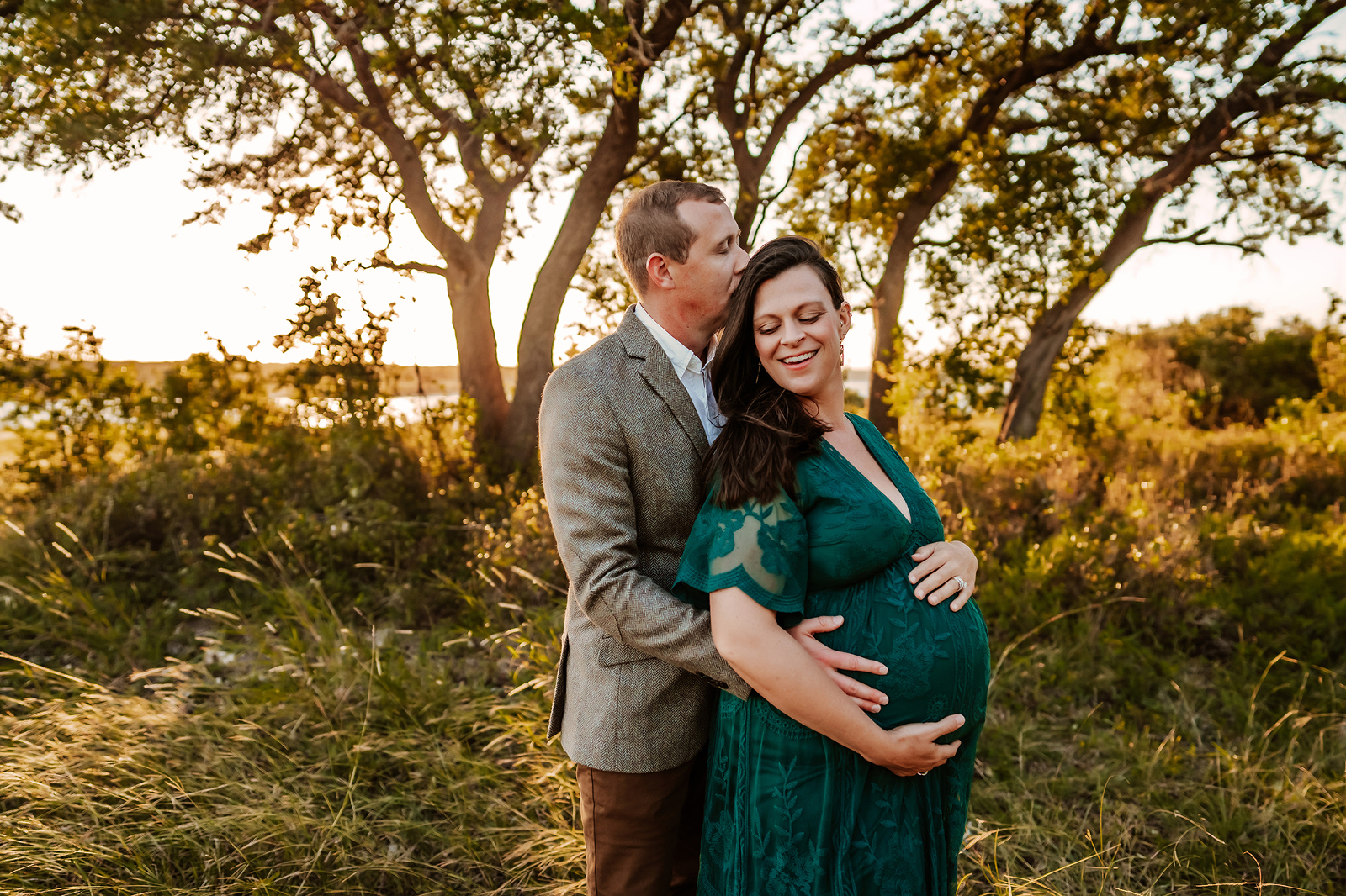 Maternity Session with couple in field photographed by natural light photographer in Georgetown Texas