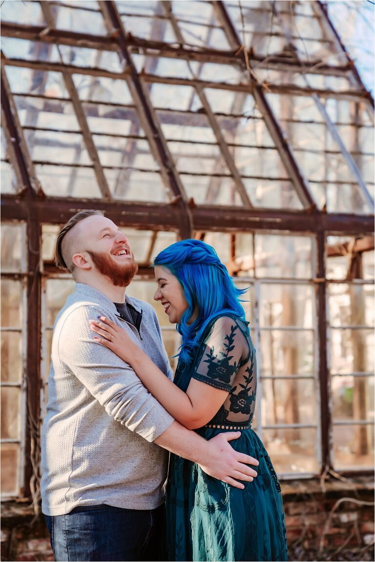 Behind the scenes of couple laughing during engagement photoshoot in Austin Texas