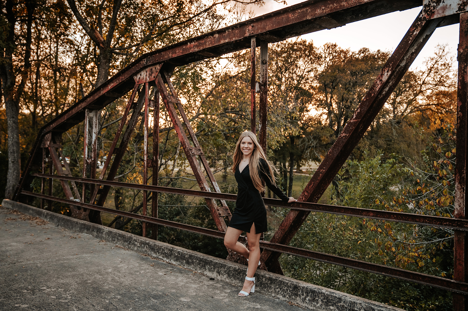 Senior photoshoot on bridge in Pflugerville Texas by natural light portrait photographer