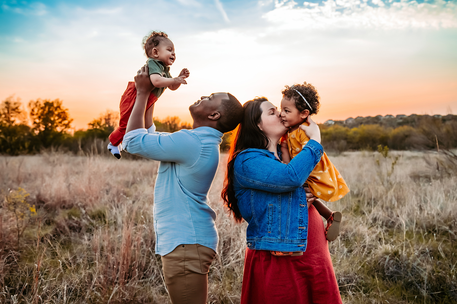 Family playing together at park during photoshoot with natural light Austin Texas photographer